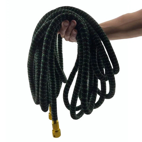 Expandable hose in use watering a garden